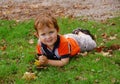 Little boy laying on the grass Royalty Free Stock Photo