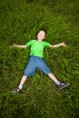 Little boy laying on the grass Royalty Free Stock Photo