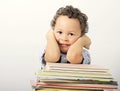 Little boy leaning on his school books Royalty Free Stock Photo