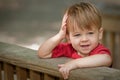 Little boy leaning on railing Royalty Free Stock Photo