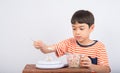 Little boy leaning weight scale mathmatic education in class Royalty Free Stock Photo