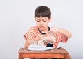 Little boy leaning weight scale mathmatic education in class Royalty Free Stock Photo