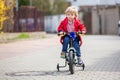 Little boy, learning how to ride a bike in the parkLittle child, blond boy, learning how to ride a bicycle in the park using Royalty Free Stock Photo