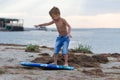 Little boy learning how to surf