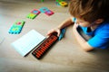 Little boy learning numbers, mental arithmetic, abacus