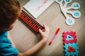 Little boy learning numbers, mental arithmetic, abacus