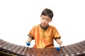 Little boy learning Thai instument Xylophone, Ranat, on white background