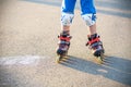 Little boy learning to roller skate in summer park. Children wearing protection pads for safe roller skating ride. Active outdoor Royalty Free Stock Photo