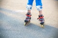 Little boy learning to roller skate in summer park. Children wearing protection pads for safe roller skating ride. Active outdoor Royalty Free Stock Photo