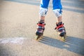 Little boy learning to roller skate in summer park. Children wearing protection pads for safe roller skating ride. Active outdoor Royalty Free Stock Photo