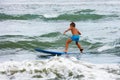 Little boy learning to surf in the stand on board Royalty Free Stock Photo