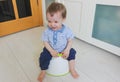 A little boy learns to go potty. Accustom the child to the potty Royalty Free Stock Photo