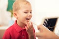 Little boy during lesson with his speech therapist. Royalty Free Stock Photo
