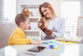 Little boy during lesson with his speech therapist.