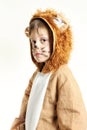 Little boy in lion coat looking to the left