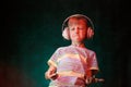 Little boy listens favorite music in modern wireless headphones, in the studio Royalty Free Stock Photo