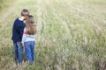 Little boy and little girl standing holding hands looking on horizont. Rear view. Royalty Free Stock Photo