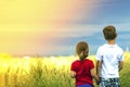 Little boy and little girl standing holding hands looking on hor Royalty Free Stock Photo