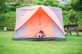 Little boy living inside the tent the park Royalty Free Stock Photo