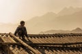 little boy of local village standing on his house rooftop in Sapa, Vietnam