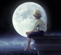 Little boy looking a the city in the night Royalty Free Stock Photo