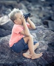 Little boy looking far away with binoculars Royalty Free Stock Photo