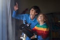 Little boy looking at stars through telescope Royalty Free Stock Photo