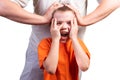 A little boy looks at the phone, and is surprised. Isolated on a blue background Royalty Free Stock Photo