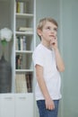 Little boy lost in thoughts at home Royalty Free Stock Photo