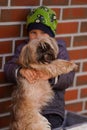 Little boy lovingly hugging his dog. Focus on the dog. Royalty Free Stock Photo