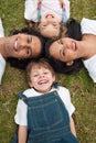 Little boy lying with his family in a park Royalty Free Stock Photo