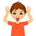 Little boy making mocking expression with hands Royalty Free Stock Photo