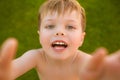 Little boy making selfie on the grass Royalty Free Stock Photo