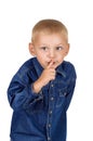 Little boy making silence gesture