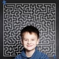 Little boy and maze on chalkboard background Royalty Free Stock Photo