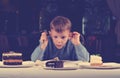 Little boy mesmerised by an assortment of cakes Royalty Free Stock Photo