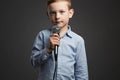 Little Boy With Microphone. Child Singing A Song