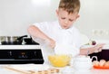 Little boy mixing cake ingredients Royalty Free Stock Photo