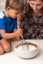 Little boy mixing pie dough Royalty Free Stock Photo