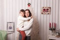 Little boy with mom posing in Christmas interior Royalty Free Stock Photo