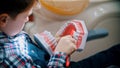 A little boy in the moren dentistry - brushing teeth of the plastic model of human jaws Royalty Free Stock Photo