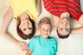 Little boy with mother and father lying on fuzzy rug Royalty Free Stock Photo