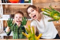 Little boy and mother showing hands painted in colorful paints Royalty Free Stock Photo