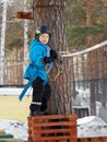 Little boy mountaineering in winter