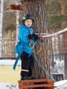 Little boy mountaineering in winter