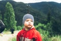 Little boy in mountains make faces Royalty Free Stock Photo