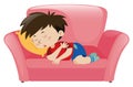 Little boy napping on pink sofa Royalty Free Stock Photo