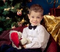 Little boy near Christmas tree Royalty Free Stock Photo