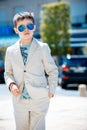 Little boy in a nice suit and glasses. Back to Royalty Free Stock Photo