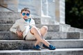 Little boy in a nice suit and glasses. Back to Royalty Free Stock Photo